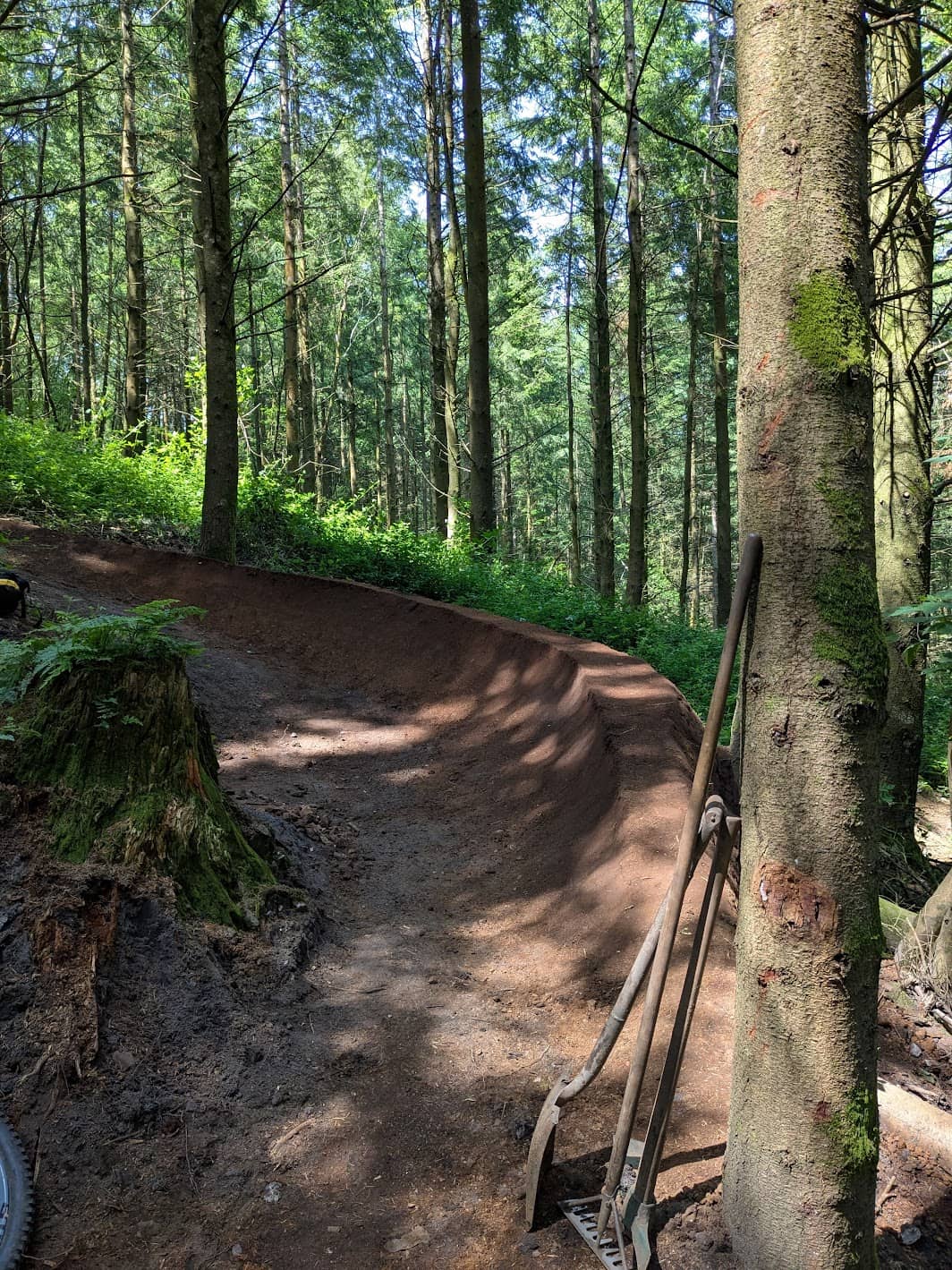 A refreshed berm from CafesideMTB trail maintenance over the summer of 2025